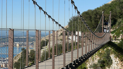 Fototapeta premium The Windsor suspension Bridge in Gibraltar, a bridge spanning a gorge on the rock. Wide angle