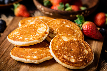 Pancakes on a cutting board. 