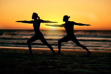 Couple, silhouette and beach yoga at sunset for health, fitness and wellness. Warrior pose, zen...