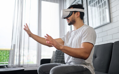 Virtual reality, hands and man on sofa with futuristic headset for interactive, online and 3d games...
