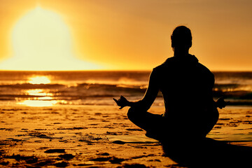 Lotus, yoga and silhouette of man at beach outdoors for health and wellness. Sunset, zen meditation...