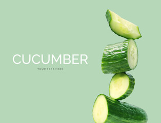 Creative layout made of cucumber on the green background. Flat lay. Food concept. 