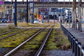 Obraz premium Tramway with tracks of tram line four and modern foot bridge in the background at City of Zürich on a blue cloudy winter day. Photo taken January 2nd, 2023, Zurich, Switzerland.