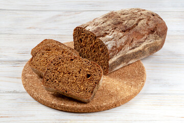 Bread and slices on a round board