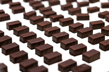 Production of chocolate candy. Sweets on conveyor belt at factory