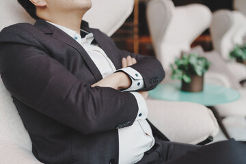 Close up of young business man and digital number of stock market background to represent successful in investment marketing. Find out the best solution in business and financial as concept.