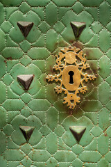 Background with gold lock on emerald green door