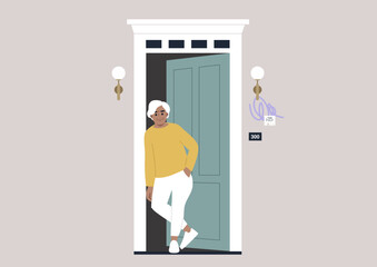 A senior Caucasian lady waiting in the doorway at the entrance at the building, daily neighborhood life