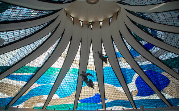 Brasilia, Brazil, 2016: angels of the "Catedral de Bras&iacute;lia". Stained glass compose part of the architecture details. Inside view of the church. Silhouette of the angels.