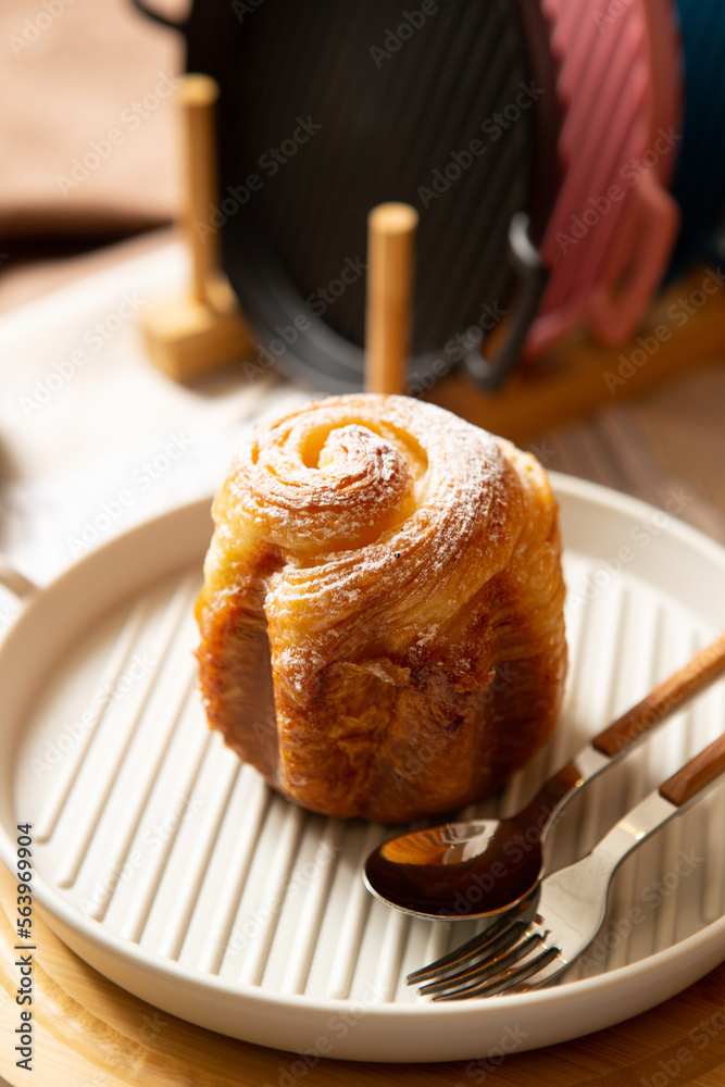 Wall mural cinnamon rolls on plate and tableware