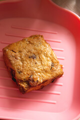 Close-up of scones on a pink plate