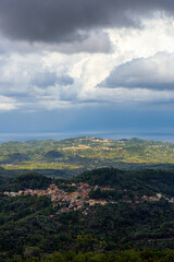 Fototapeta na wymiar Moody sky over mountains in corfu Greece. Panoramic landscape scenery.