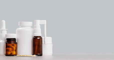 pharmacy order delivery banner. prescription drugs and over the counter medication. Pills jar and spray mockup vial containers on grey. Drugstore shopping copy space banner