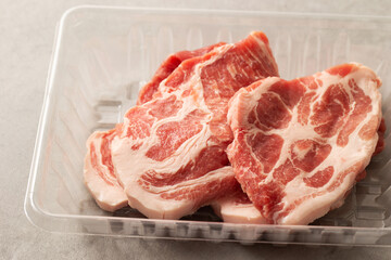 Fresh neck meat in packaging container	