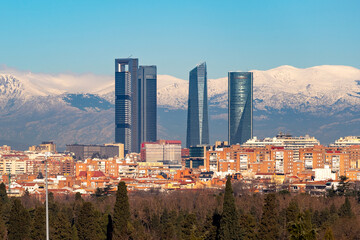 Madrid. Skyline of the city of Madrid with the Sierra de Guadarrama. White mountain full of white snow. City concept. Winter concept. Photography. Madrid photography. Panoramic photography. Panoramic. - obrazy, fototapety, plakaty