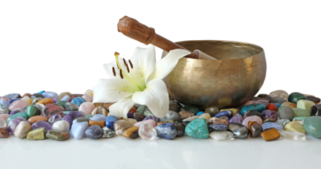 Tibetan singing bowl and mallet on top of many different healing crystals with a lily flower head resting next to bowl transparent png file