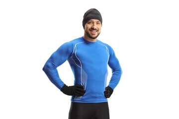 Full length portrait of a young man in running clothes and a hat