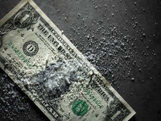 Dollar bills and drug powder