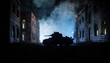 War Concept. Military silhouettes fighting scene on war fog sky background, World War Soldiers Silhouette Below Cloudy Skyline At night. Battle in ruined city.