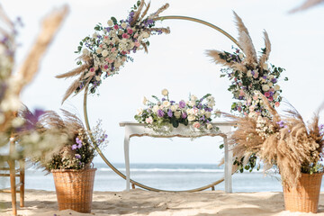 Wedding set up on beach. Beautiful tropical outdoor ceremony or party with ocean view. Destination...