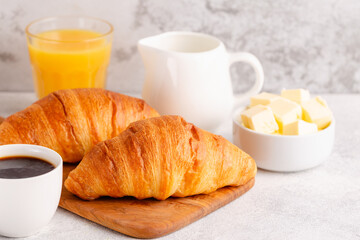 Hot coffee, croissants on a light background, selective focus.