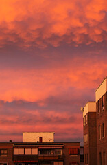 A pink and reddish sunset with clouds
