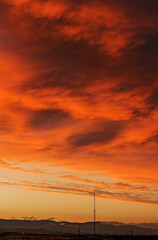A pink and reddish sunset with clouds