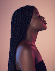 Peace, calm and black woman with braids in a studio with a makeup, cosmetic and face routine. Sensual, cosmetics and African female model with a relaxing positive mindset isolated by pink background. - obrazy, fototapety, plakaty