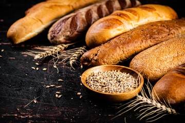 Various bread with grain in a bowl on the table. 
