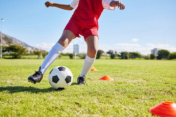 Soccer kid, field and training for sport fitness, balance and control with speed, body health and development. Cropped football player child, fast dribbling and exercise feet on pitch with commitment