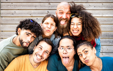 Young friends taking selfie making funny face expression - Happy life style concept with millenial...
