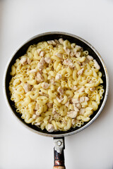 Boiled vermicelli with pork meat. Delicious meat breakfast. Vermicelli with meat.