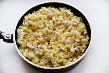 Boiled vermicelli with pork meat. Delicious meat breakfast. Vermicelli with meat.