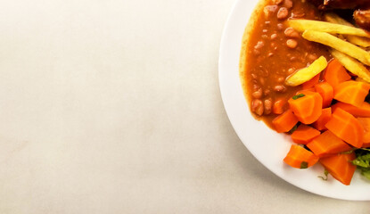 Partial side view of Typical and colorful Brazilian meal  called 