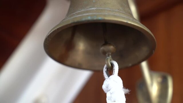Sound the bell on the yacht. Slow motion