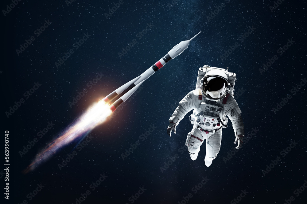 Wall mural astronaut in a white spacesuit in space against the backdrop of a rocket. exploration of space and o