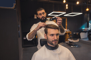 Barber doing hairstyling with the powder