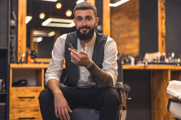 Handsome stylish barber at this working place