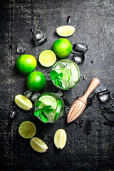 Traditional mojito with pieces of lime and mint. 