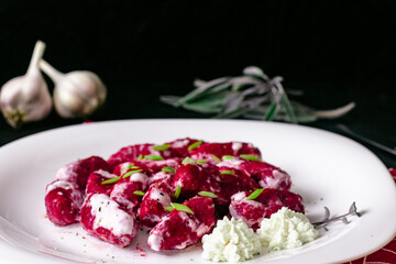Dumplings Italian cuisine. Gnocchi. Beetroot dishes. Put vegetables
