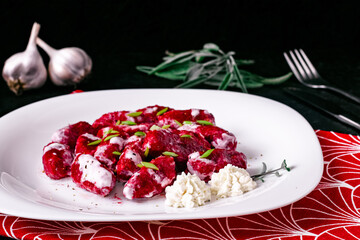Dumplings Italian cuisine. Gnocchi. Beetroot dishes. Put vegetables