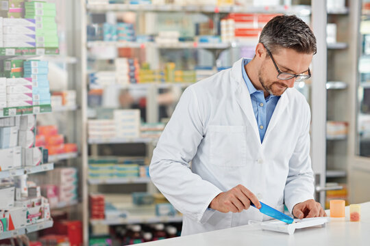 Pharmacist Man, Store And Counting With Pills, Medicine And Focus For Health, Product Or Sales. Medical Professional, Pharma Expert Or Sorting Medication In Pharmacy For Wellness, Healthcare And Job