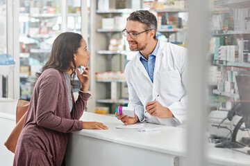 Pharmacist, customer and health with medicine and advice, discussion and service in pharmacy, advice and pills prescription. Healthcare, medical store with pharmaceutical drugs, man and woman talk