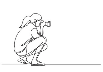 continuous line drawing vector illustration with FULLY EDITABLE STROKE of woman making photos with camera