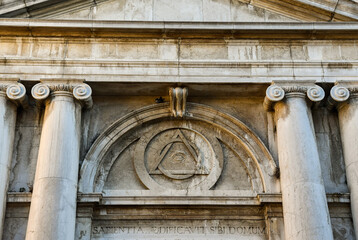 Detail of the masonic symbols over the portal of the Church of La Maddalena, sestiere of...