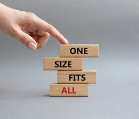 One size fits all symbol. Concept words One size fits all on wooden blocks. Beautiful grey...
