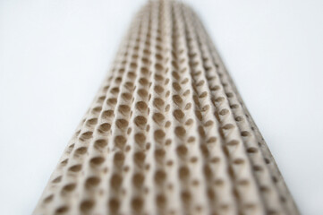 blurred cardboard tube with holes