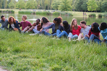 Group of young people from different origins spending an afternoon together in the park. Concept:...