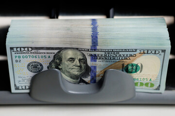 Currency counting machine counting dollar. Money counting equipment for paper money calculation....