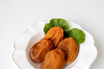 White plate of Dried Persimmon on the white background